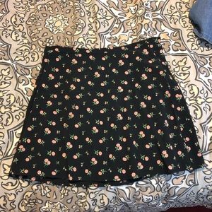 Black skirt with pink roses.